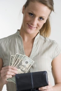 woman taking money out of wallet