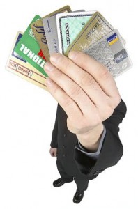 Hand holding batch of credit cards credit card debt