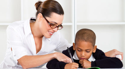 Woman tutoring small boy to earn extra money to pay off debt