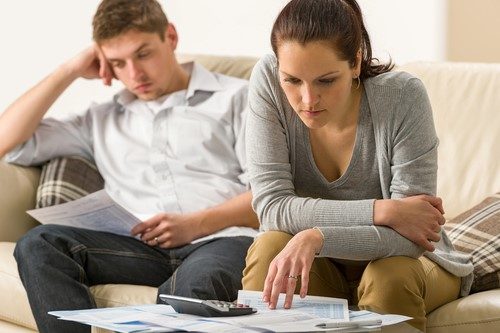 Worried couple discussing joint credit card