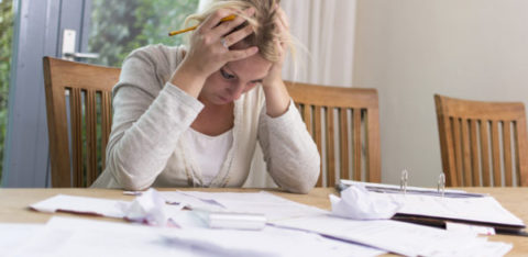 women frustrated in debt with bad credit